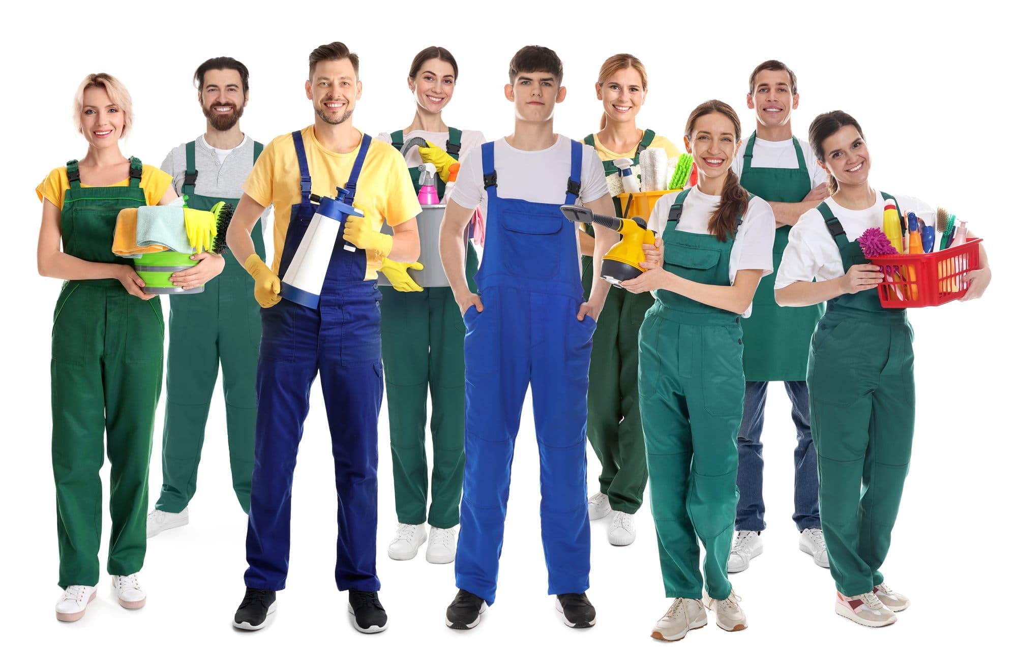 Nine people standing in a group on a white background, wearing green and blue work overalls or aprons, several holding buckets, spray bottles, a steam cleaner and a basket of cleaning supplies
